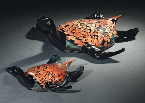Murano glass turtles in black and speckled amber
