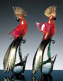 Pair of red and gold parrots with long tailfeathers