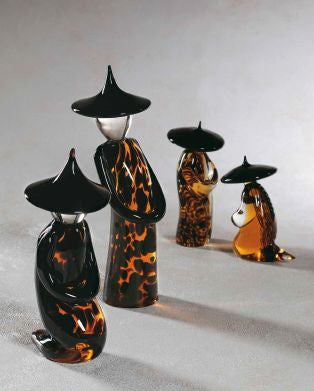 Chinese figurines in speckled amber