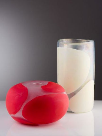 Irridescent coral and white vases with spots