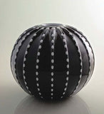 Black spherical vase with contrasting colour
