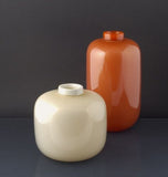 White and orange vases with gold leaf